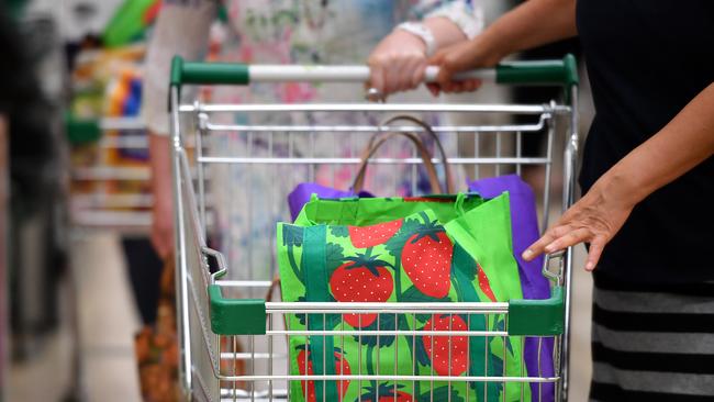 Environmentally-friendly shopping bags at a Woolworths store.