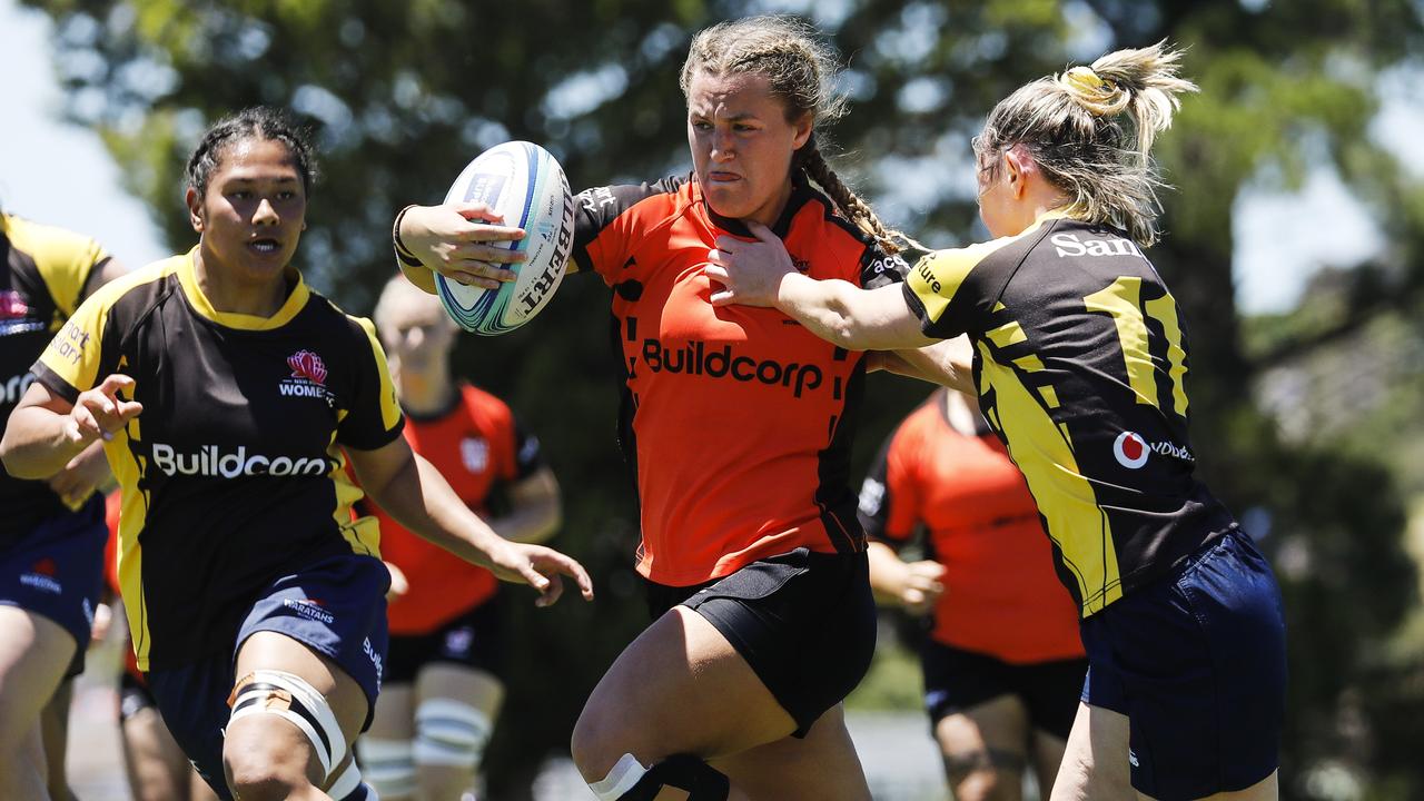 Arabella McKenzie breaking through the Sydney Gold defence in the last match of the Chikarovski Cup at Ann Ashwood Oval, Bathurst. Pic: Karen Watson.