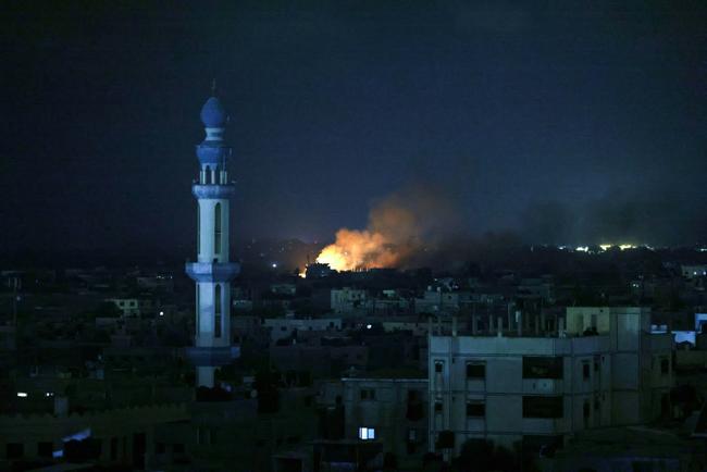 A fire burns following Israeli air strikes in Rafah in the southern Gaza Strip