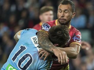 Quade Cooper of the Reds Tackles Bernard Foley high.  NSW Waratahs Vs QLD Reds, at Allianz Stadium on Saturday 13th June 2015. Pic: Mitch Cameron