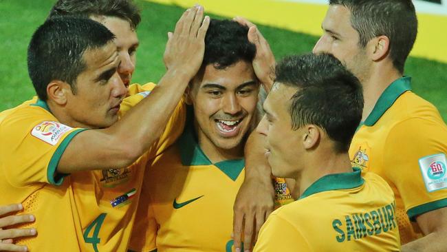 MELBOURNE, AUSTRALIA - JANUARY 09: Massimo Luongo of the Socceroos is congratulated by Tim Cahill and his teammates after scoring a goal during the 2015 Asian Cup match between the Australian Socceroos and Kuwait at AAMI Park on January 9, 2015 in Melbourne, Australia. (Photo by Scott Barbour/Getty Images)