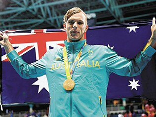 Australia's Kyle Chalmers celebrates with his gold medal in the 100m freestyle at the Rio Olympics.