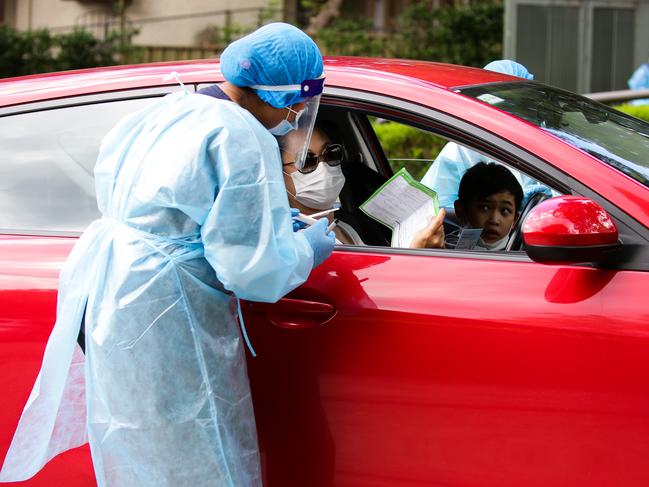 SYDNEY, AUSTRALIA - NewsWire Photos JANUARY 05, 2021: A Nurse is seen checking in a local resident of the Northern Beaches for testing of the Corona Virus at the Killara pop up drive-thru testing COVID-19 clinic in Sydney, Australia. Picture: NCA NewsWire / Gaye Gerard