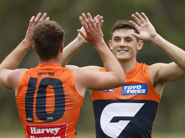 Giants Conor Stone celebrates kicking a goal  with Jacob Wehr during an AFL pre-season practice match between the GWS Giants and Gold Coast Suns at Blacktown International Sportspark on  March 4, 2023. Photo by Phil Hillyard(Image Supplied for Editorial Use only - **NO ON SALES** - Â©Phil Hillyard )