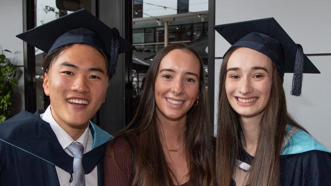 Jade Lai, Melanie and Lauren Robinson celebrate graduation. Picture: Brad Fleet