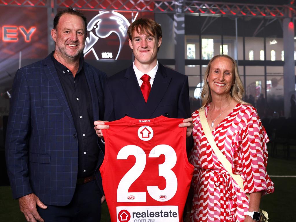 Ned Bowman and his new No.23 jumper with parents Lachy and Jodie at the Swans Guernsey Presentation night. Picture: Phil Hillyard