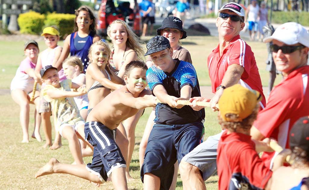 Kids take part in tug o’ war in Chris Cunningham Park at Tweed Heads yesterday. . Picture: Blainey Woodham