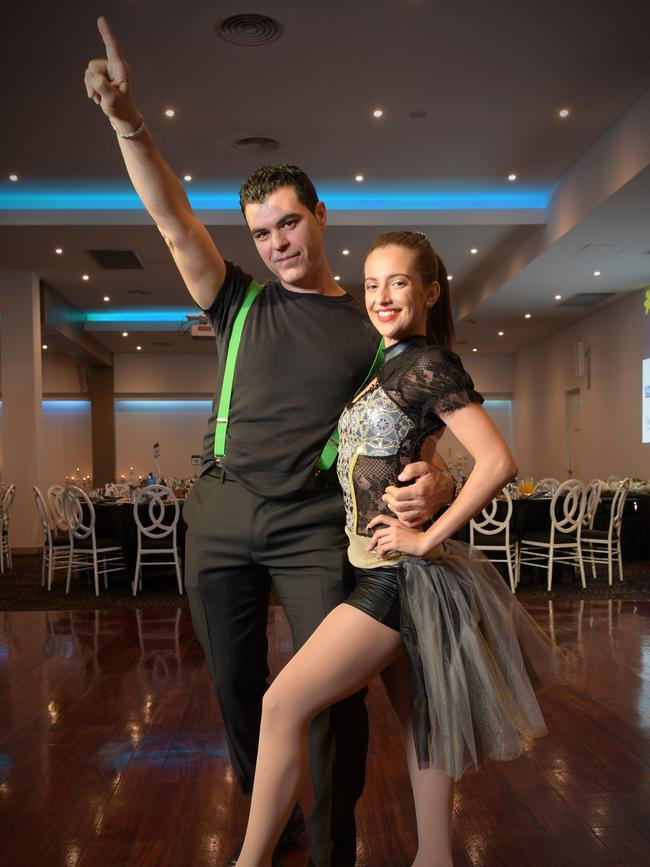 Fairfield City Business President, Vince Movizio warms up with dancer, Stephanie Oliveri for the Dance for Cancer at the Grand Paradiso in Fairfield. (AAP IMAGE/Simon Bullard)