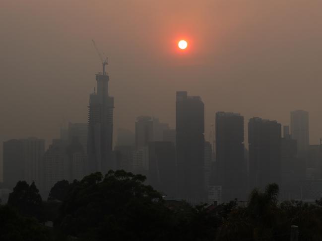 The Sydney skyline is seen from Balmain as winds blow smoke from bushfires over the CBD in Sydney, Friday, November 22, 2019. Heavy smoke is again affecting large parts of NSW. (AAP Image/Dylan Coker) NO ARCHIVING