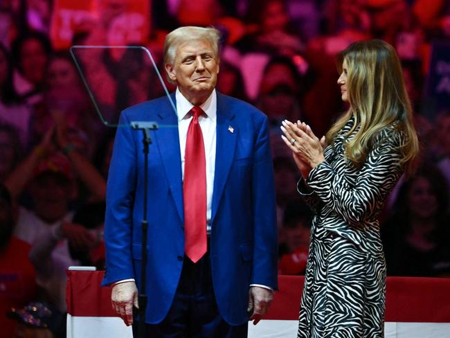 Former US First Lady Melania Trump applauds her husband. Picture: AFP