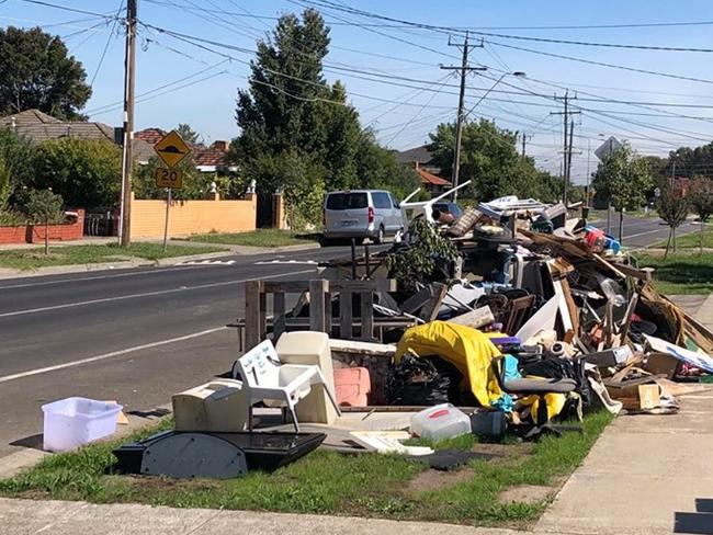 Hard waste piled up on a nature strip outside a Thomastown home.