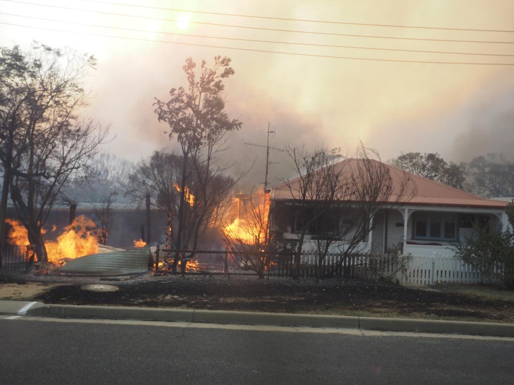 A bush fire rages in the town of Tathra on Sunday afternoon, March 18, 2018. Picture: John Ford