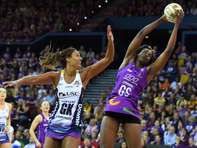 Geva Mentor puts Firebirds shooter Romelda Aiken under pressure. Picture: AAP