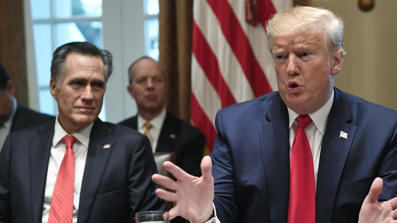 President Donald Trump speaks as he sits next to Sen. Mitt Romney, in a meeting in the Cabinet Room of the White House in Washington on Friday. Picture” AP