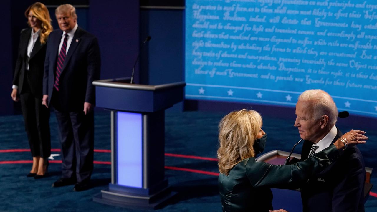 First Lady Melania Trump and US President Donald Trump look on as Democratic Presidential candidate and former US Vice President Joe Biden hugs his wife Jill Biden after the first presidential debate. Picture: Morry Gash / POOL / AFP.