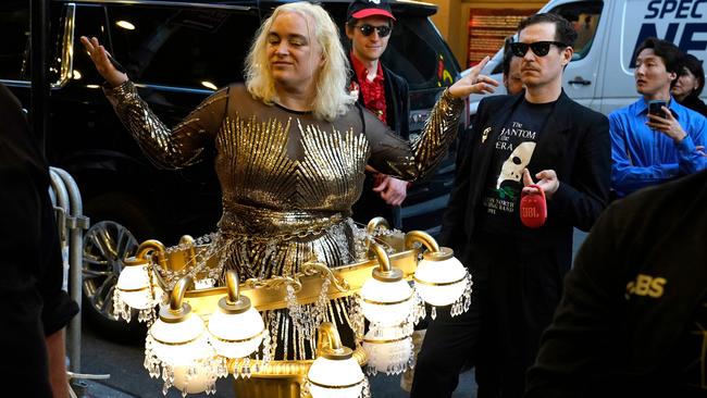 A fan dressed as a chandelier waits outside the Majestic Theatre on Monday (AEST). Picture: AFP