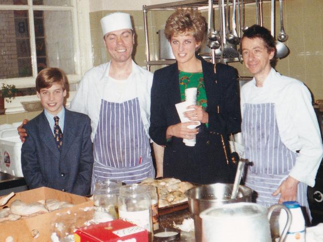 Princess Diana (2R) with her 11-year-old son William (L), now the Prince of Wales in the kitchens during one of his first visits to homelessness charity, The Passage in London in 1993. Picture: AFP Photo