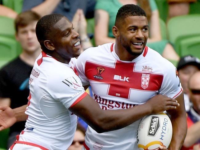 Jermaine McGillvary of England (left) is congratulated by teammate Kallum Watkins after scoring a try during the Rugby League World Cup quarter finals match between Papua New Guinea and England at AAMI park in Melbourne, Sunday, November 19, 2017.(AAP Image/Joe Castro) NO ARCHIVING, EDITORIAL USE ONLY