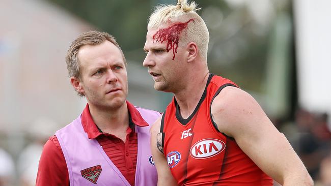 Jake Stringer is helped from the field. Picture: Michael Klein