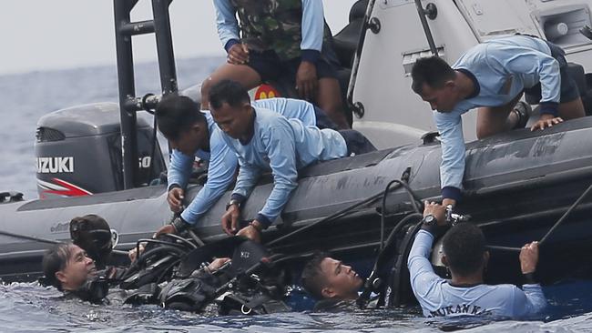 ‘It is hard because so far only body parts have been recovered’: Indonesian navy frogmen search for the victims of the crashed Lion Air plane. Picture: AP