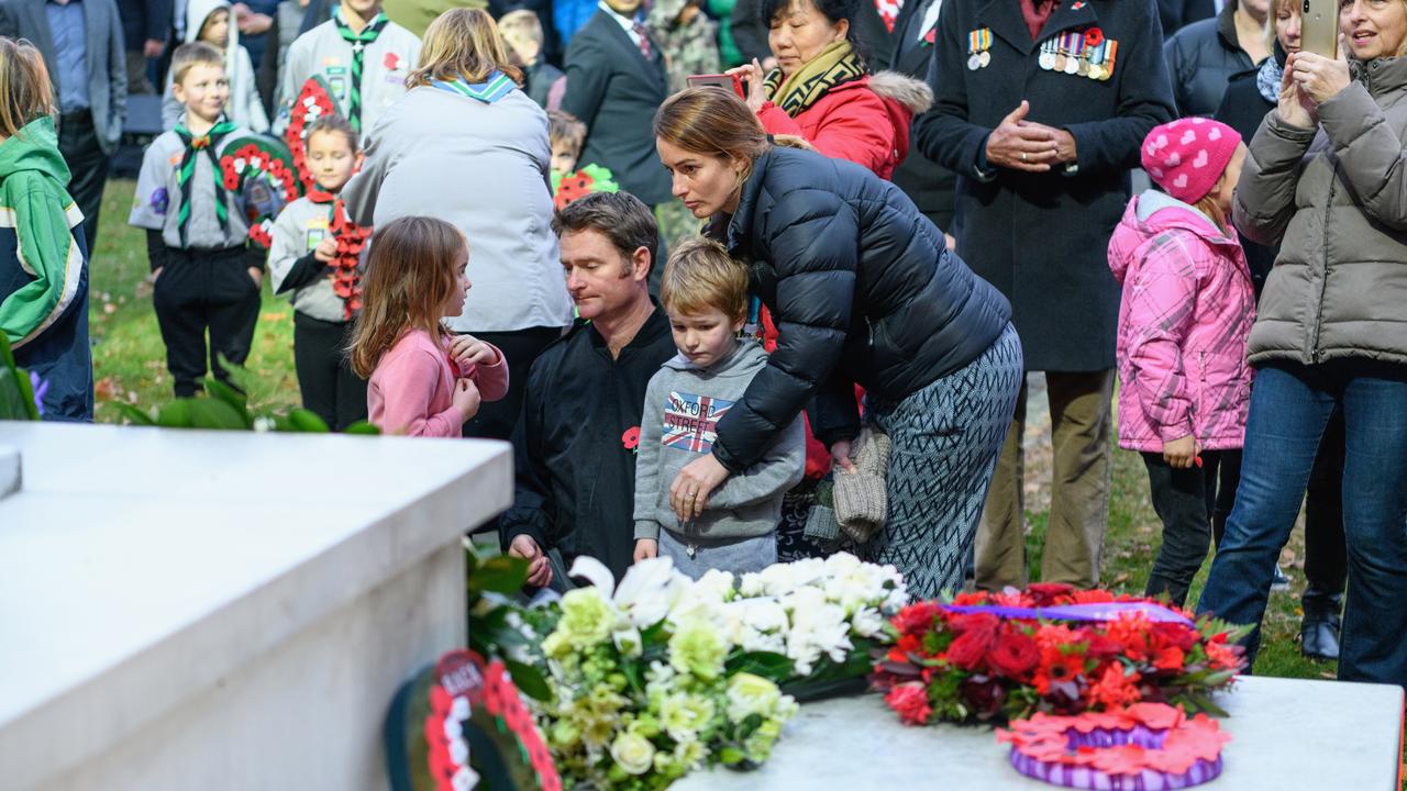 Members of the public react in front of the cenotaph during the ANZAC Day Dawn Service at Cranmer Square in Christchurch. Picture: Getty 