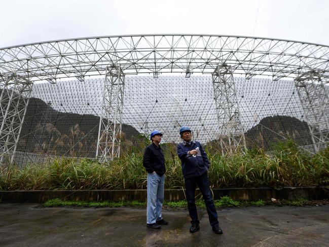 Workers at the National Astronomical Observatories of the Chinese Academy of Sciences (NAOC) in Pingtang county in Guizhou, southwest China. Picture: AFP