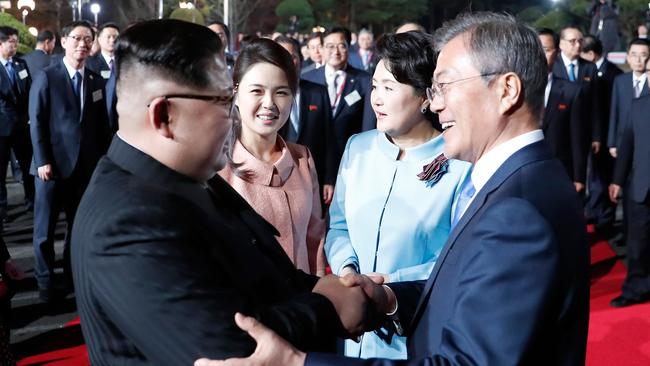 North Korea's leader Kim Jong-un and South Korea's President Moon Jae-in bid farewell after their historic April 27 meeting. Picture: AFP