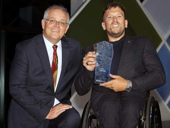 The 2022 Australian of the Year Award Dylan Alcott OAM, pictured with Prime Minister Scott Morrison receiving the award in January, on Monday launched The Field recruitment platform with Social Services Minister Anne Ruston. Picture: NCA NewsWire / Gary Ramage