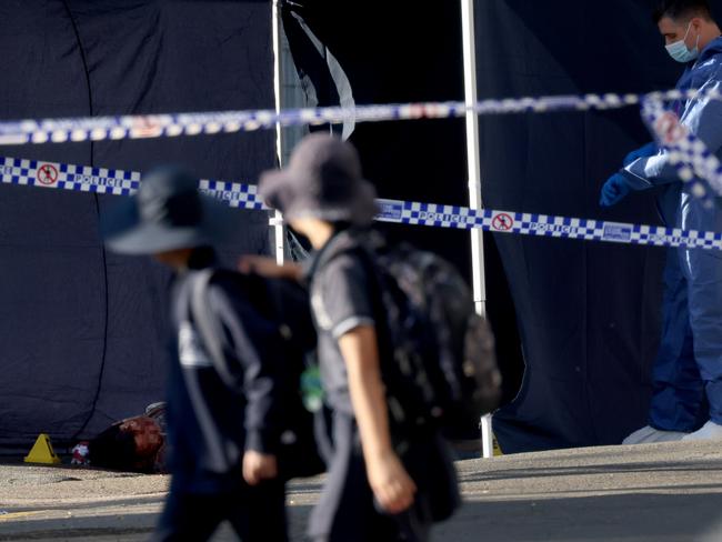 This photo of schoolkids looking on as Stemler’s dead body lay on the streets shocked the community at the time. Picture: NCA NewsWire