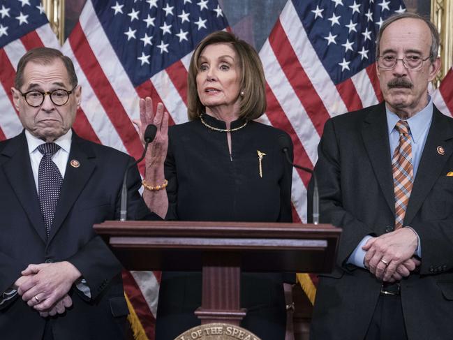 Democrat house Speaker Nancy Pelosi walked into the house chamber for the big day dressed in funeral black. Picture: AFP