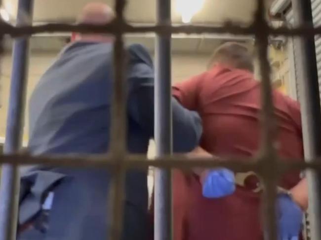 Vasilis Vergulis , the man accused of shooting his wife and daughter at Campbelltown is taken into custody  . Picture: 7NEWS