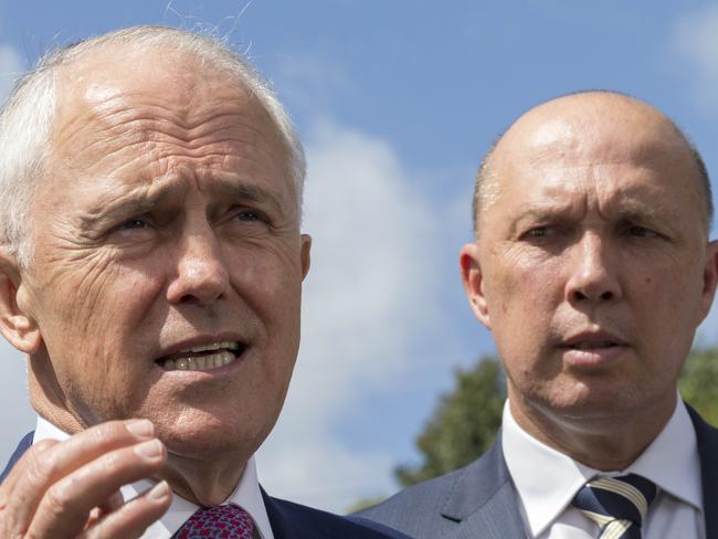 Australian Prime Minister Malcolm Turnbull (left) and Member for Dickson Peter Dutton speak to media in Murrumba Downs, Brisbane, Tuesday, April 3, 2018. Mr Turnbull announced funding for a $150 million upgrade to the Bruce Highway. (AAP Image/Glenn Hunt) NO ARCHIVING, EDITORIAL USE ONLY
