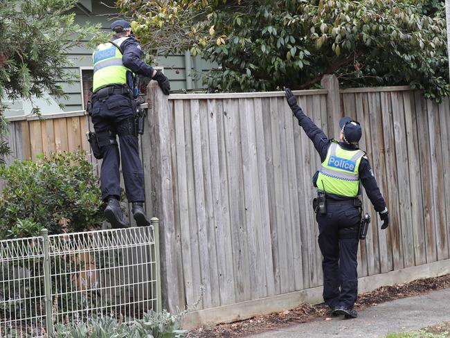 Police search for clues at the scene. Picture: David Crosling