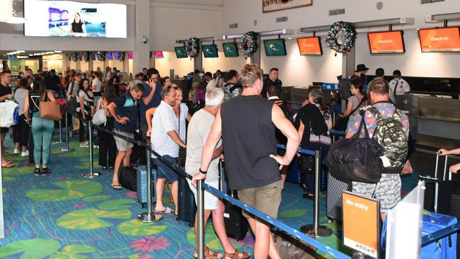 Those who managed to get a flight back to Sydney arrive at Darwin International Airport , Picture Katrina Bridgeford.