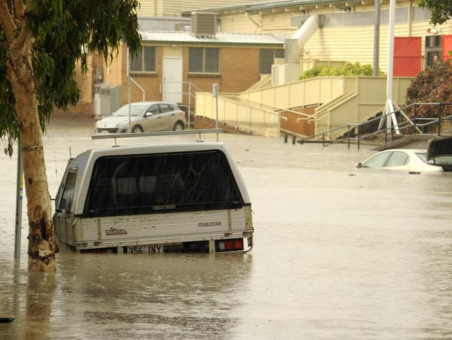Cars are submerged on Alexandra Street in Bowen Hills after heavy rainfall over Brisbane lead to flash flooding. Photo: Claudia Baxter