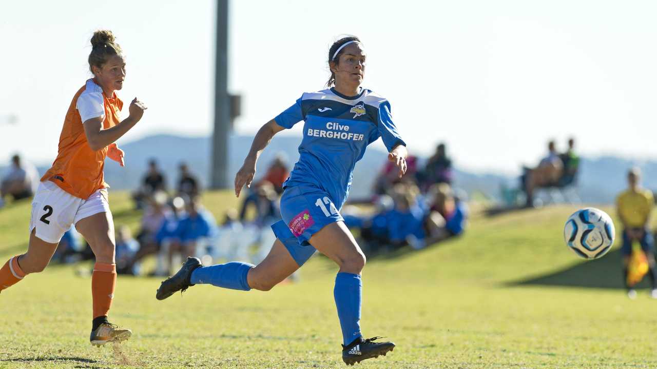 South West Queensland Thunder striker Louise Rolfe (right) breaks away from the Brisbane Roar defence. Rolfe scored in the Thunder's 4-1 defeat to the Roar. Picture: Kevin Farmer