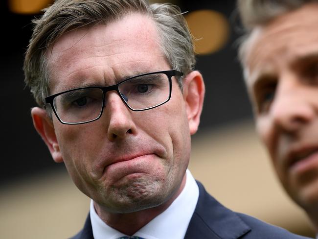 NSW Minister for Transport and Roads Andrew Constance (left) and NSW Treasurer Dominic Perrottet speak to the media at New South Wales Parliament House in Sydney, Tuesday, March 3, 2020. (AAP Image/Joel Carrett) NO ARCHIVING