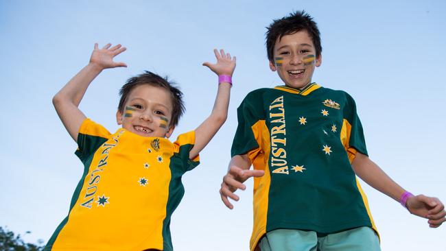 Grant McGann and Otto McGann as thousands of fans gather to watch the Matildas take on England in the World Cup Semifinal at Darwin Waterfront. Picture: Pema Tamang Pakhrin