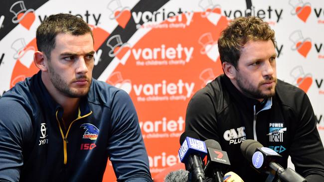 Adelaide Crows captain Taylor Walker and Port captain Travis Boak spruik the Showdown at Variety SA on Monday. Picture: AAP Image/Morgan Sette