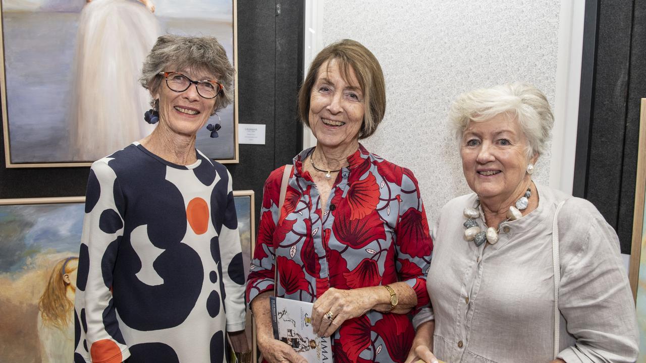 (from left) Anne Howard, Lizzie Carr and Mearon Geldard at the Toowoomba Grammar School Art Show. Saturday, March 25, 2023. Picture: Nev Madsen.