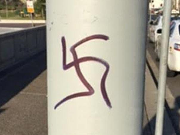 Offensive Swastika Gaffiti. Police are appealing for information following malicious damage in Sydney’s east.Yesterday (Tuesday 9 August 2016), police attended Campbell Parade, Bondi Beach following reports of malicious damage. Officers from Eastern Suburbs Local Command attended and located approximately 15 swastika symbols drawn in black permanent marker on the footpath, bus shelter, poles, benches and electrical boxes, as well as other graffiti. These symbols were obviously extremely offensive to the area's large Jewish community among others. Pic: NSW Police