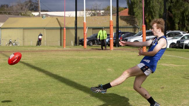 Unley Mercedes’ Jacob Earl gets a kick away against Payneham Norwood Union last month. Picture: Emma Brasier