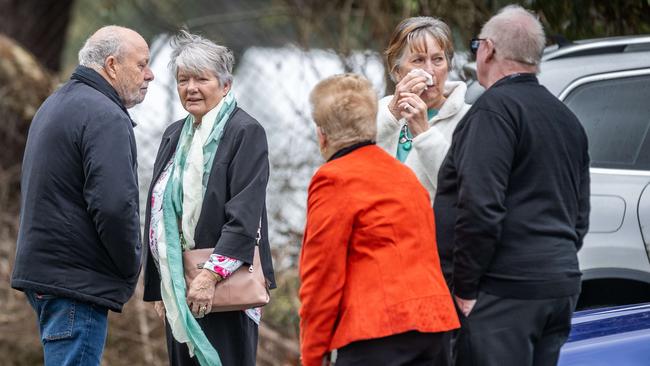 Mourners gathered outside the memorial service. Picture: Jake Nowakowski