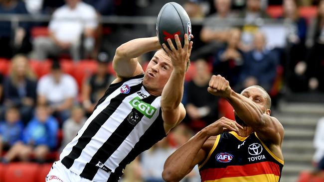 Collingwood's Ben Crocker attempts to mark against Adelaide's Cam Ellis-Yolmen Ellis. Picture: AAP Image/Sam Wundke