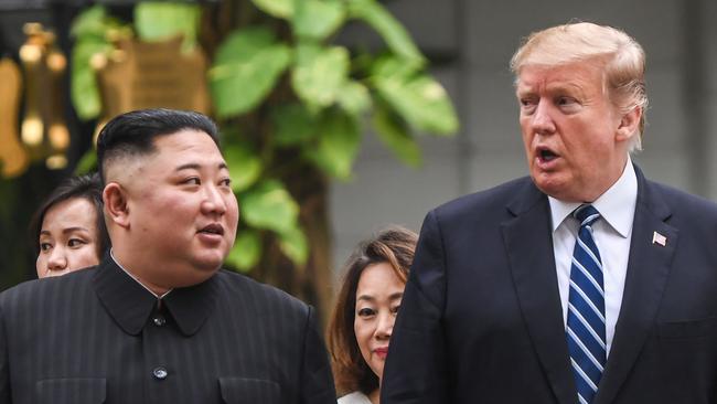 Kim Jong-un and Donald Trump in Hanoi yesterday. Picture: AFP 