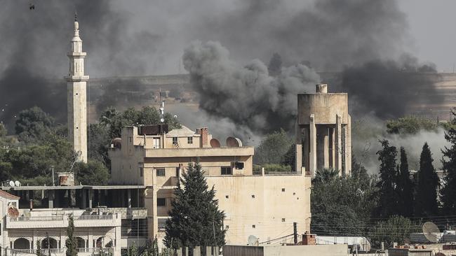 Smoke rises over the Syrian town of Ras al-Ain. Picture: Getty Images