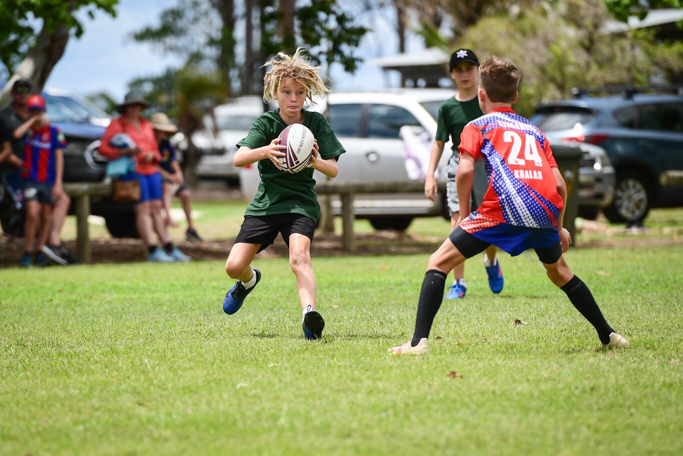 Riley Goddard with the ball for Bundaberg under 12s.