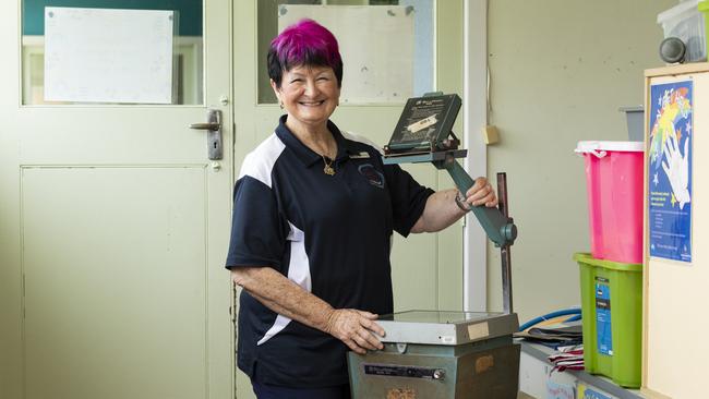 Teacher Elizabeth Kriesch with an overhead projector she continued to use regularly in her classrooms. Picture: Mark Cranitch