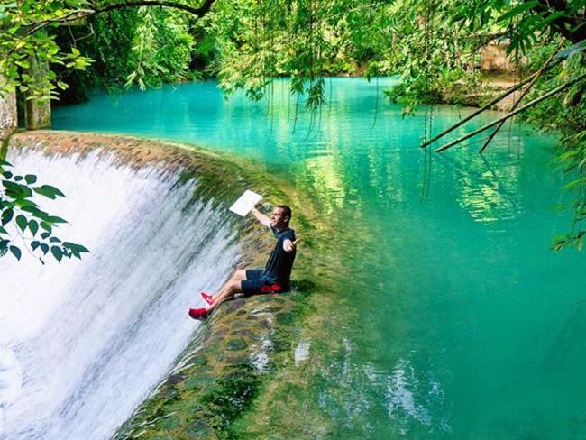 Working from the edge of a waterfall. Picture: Timothy Sykes