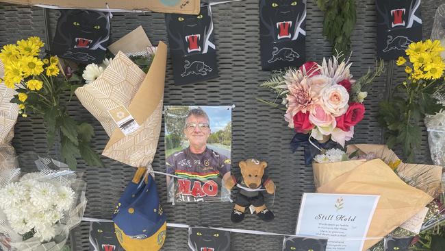 The memorial for Michael Warburton at a bus stop on Kianawah Rd where the Brisbane man was killed in a tragic hit and run crash.